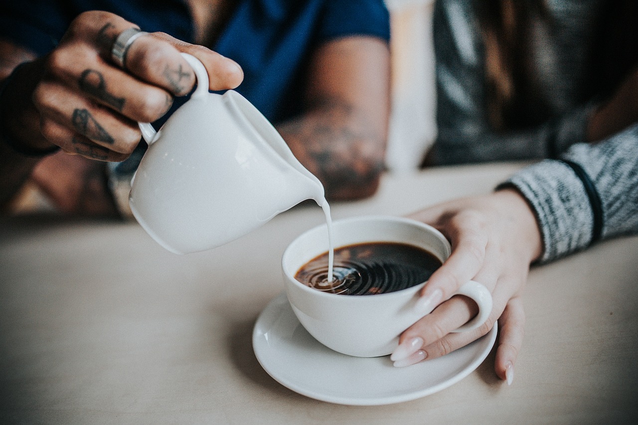 Two people sharing a hot drink