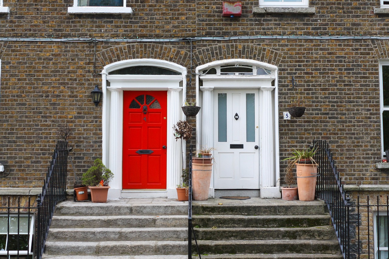 Two front doors at the top of steps