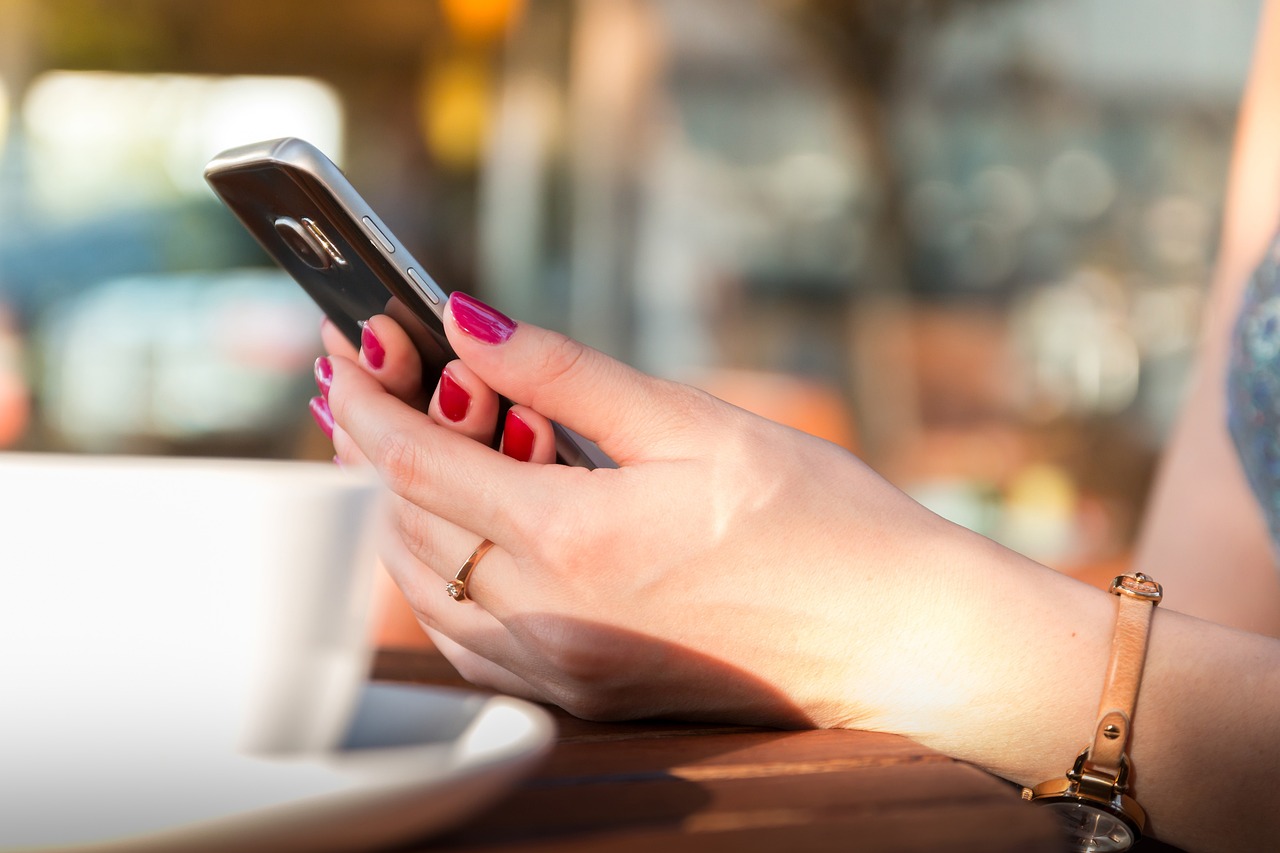 Close up of woman holding phone