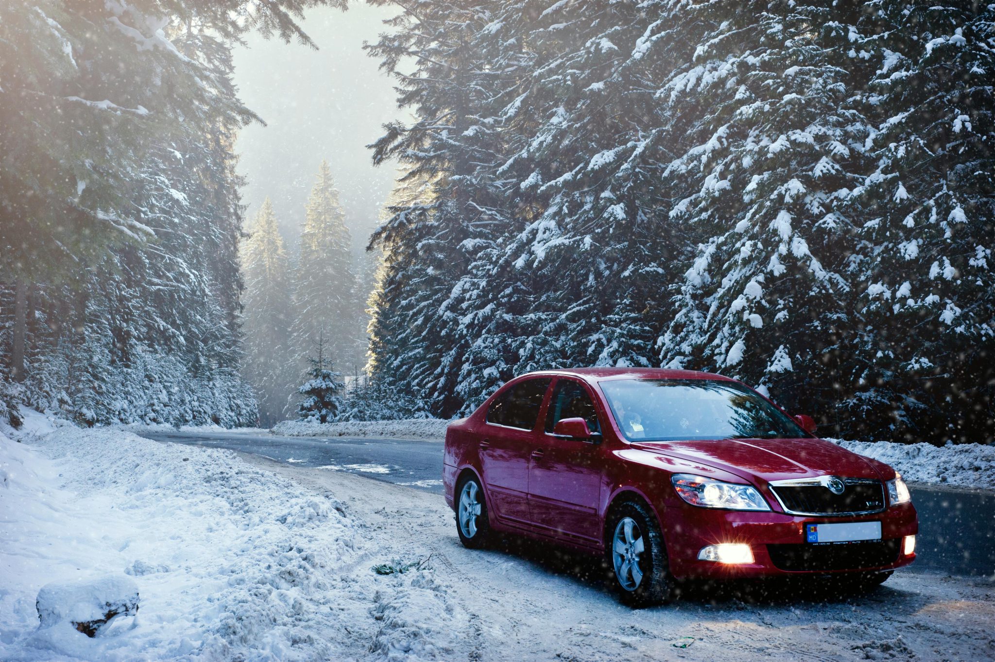 Car parked at side of the road in snow