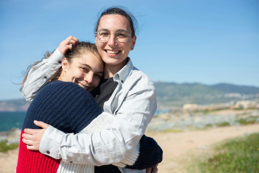 Image of friends hugging.