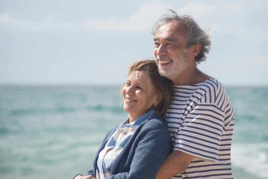 Elderly couple on the beach.