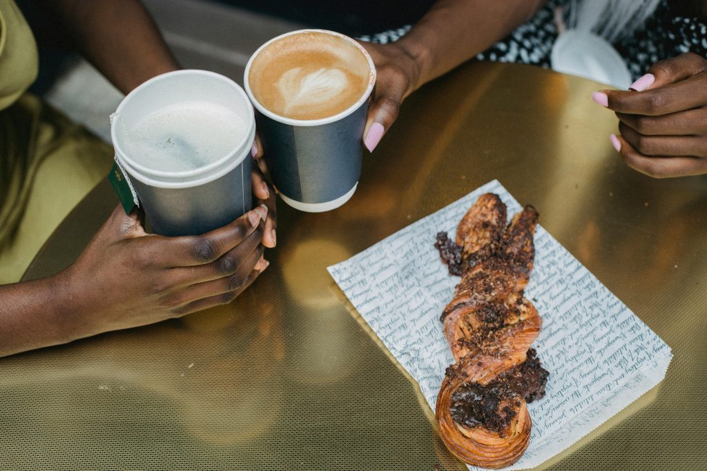 Two people sharing a coffee.