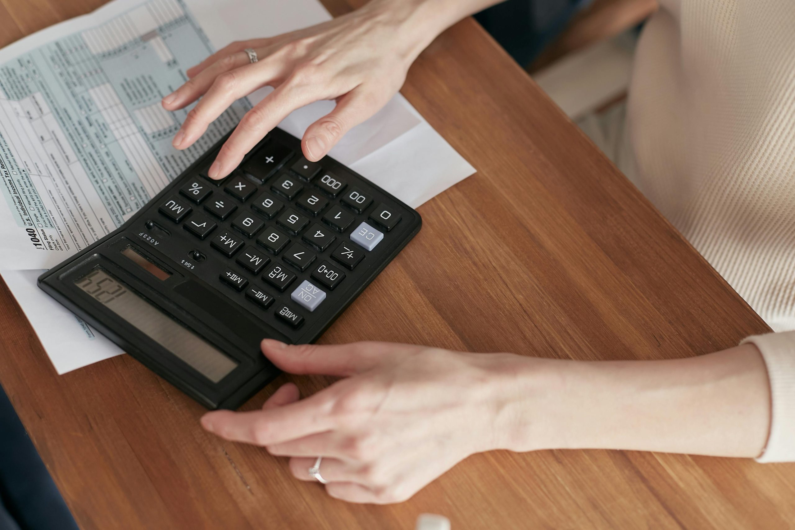 Person inputting numbers on a calculator