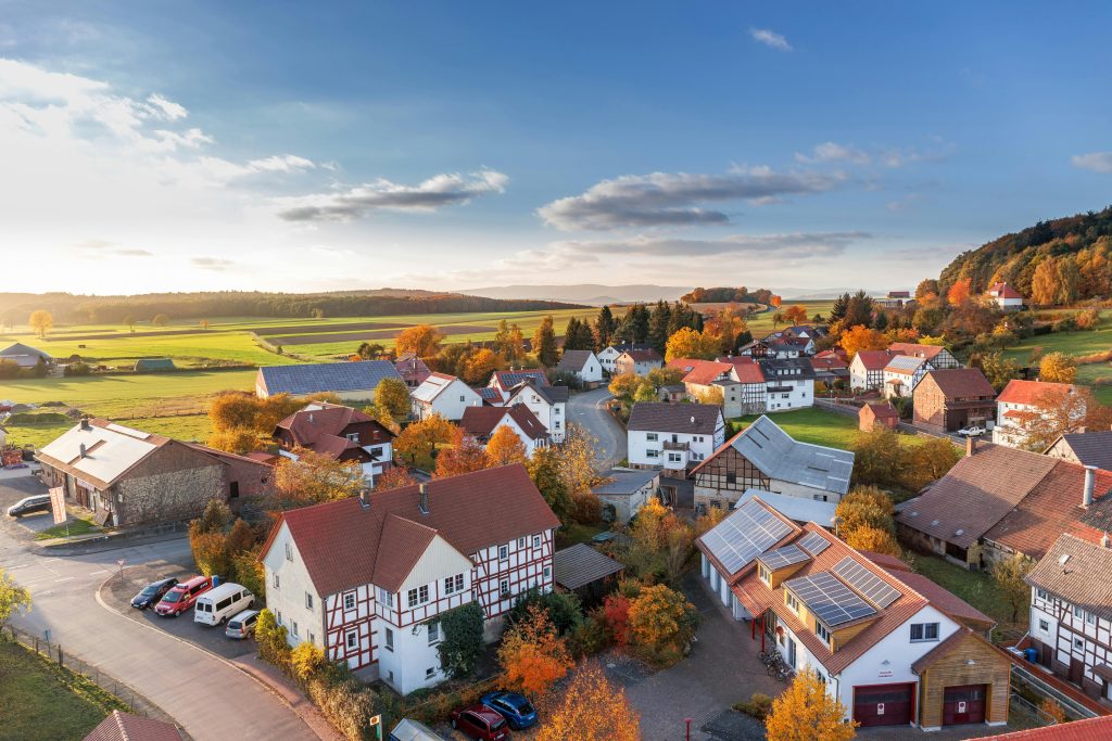 Image of houses with cars.