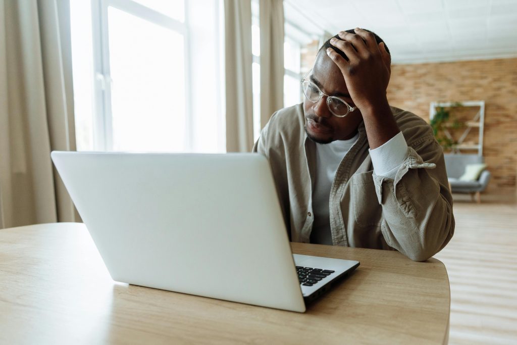 Image of a man sat at a desk.