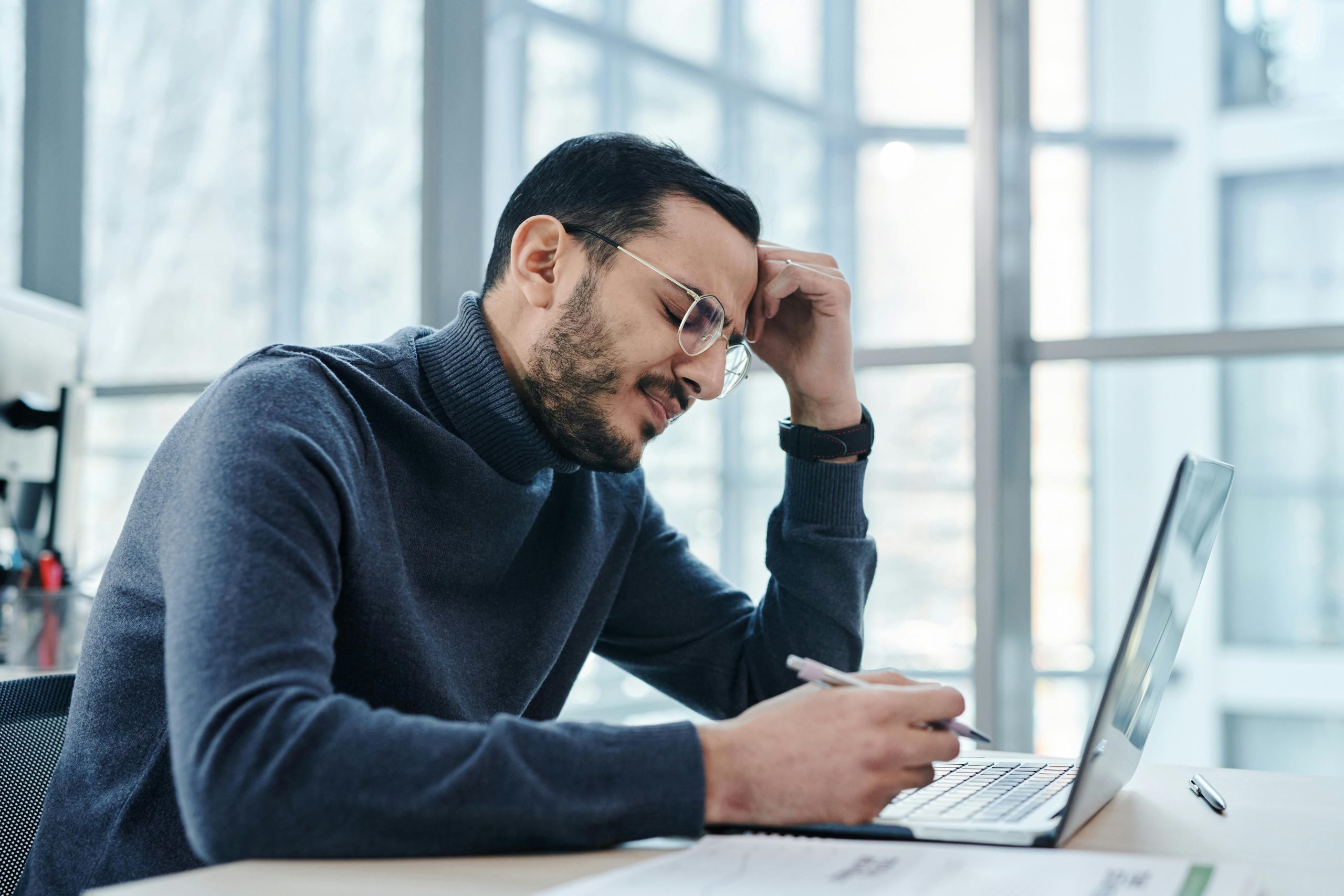 Man looking at a laptop.