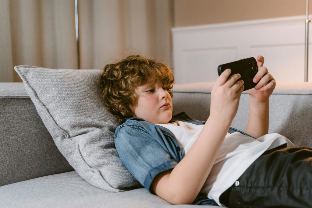 A child playing on a phone.