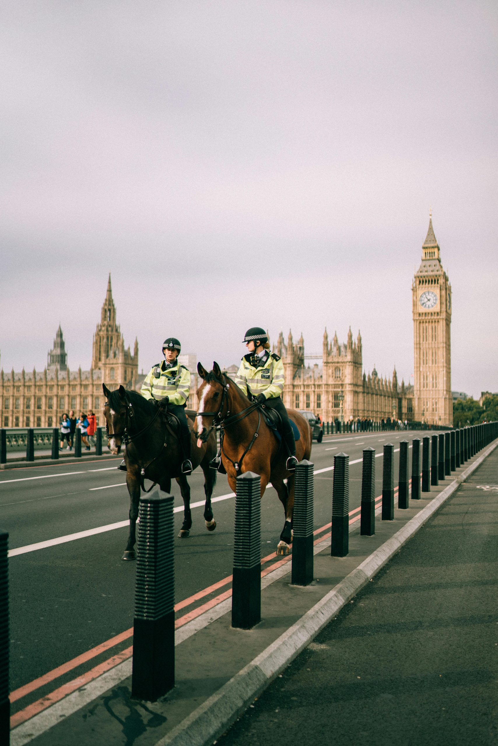 Police on horseback with Elizabeth Tower in the background