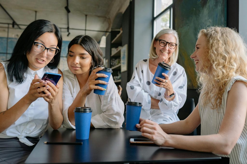 A group of women sharing a coffee.