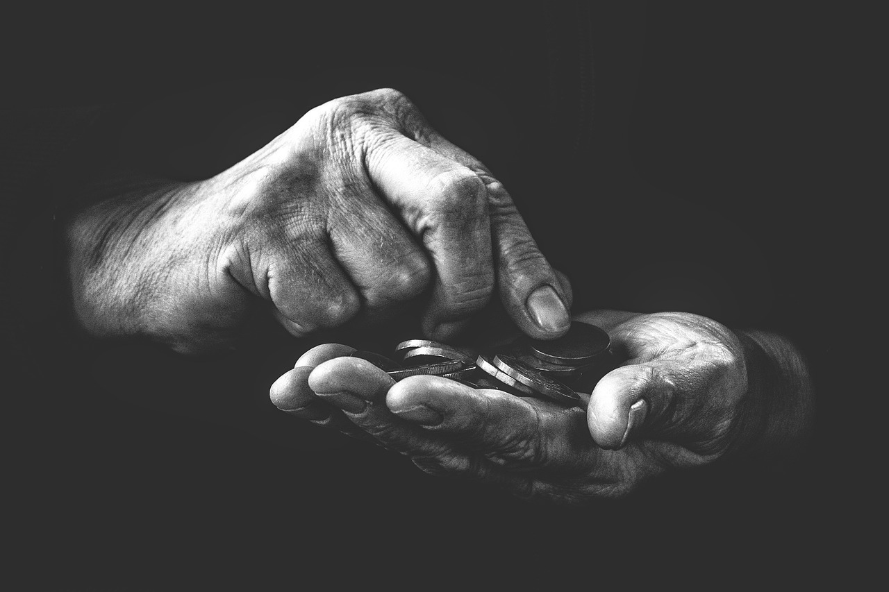 Close up of hands counting coins