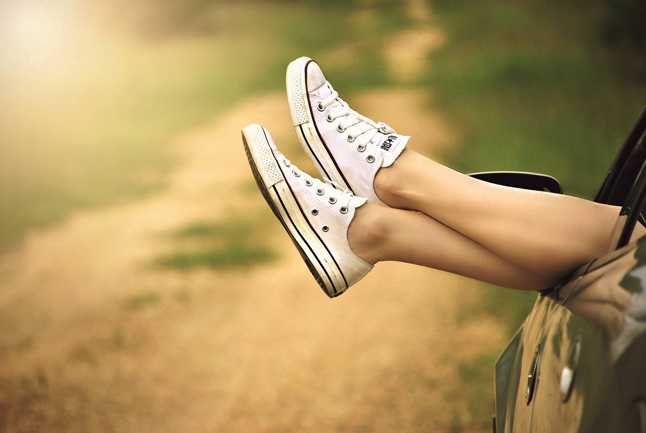 Feet outside a car window