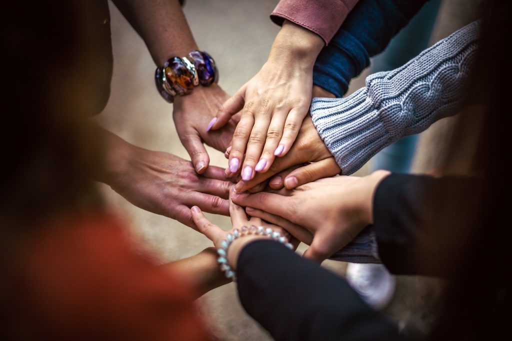 Hands touching in a group