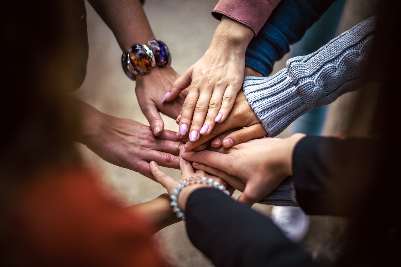 Hands touching in a group